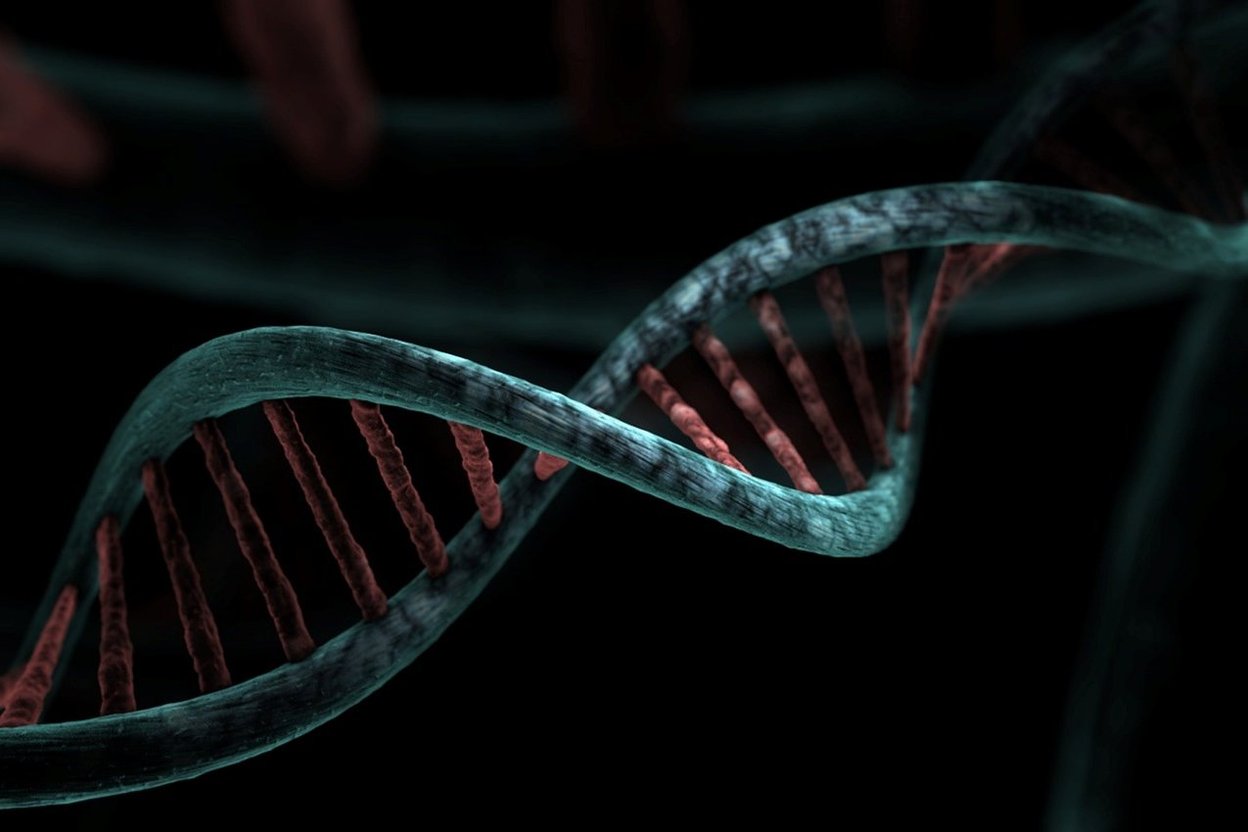 A 3D illustration of a glowing DNA double helix.