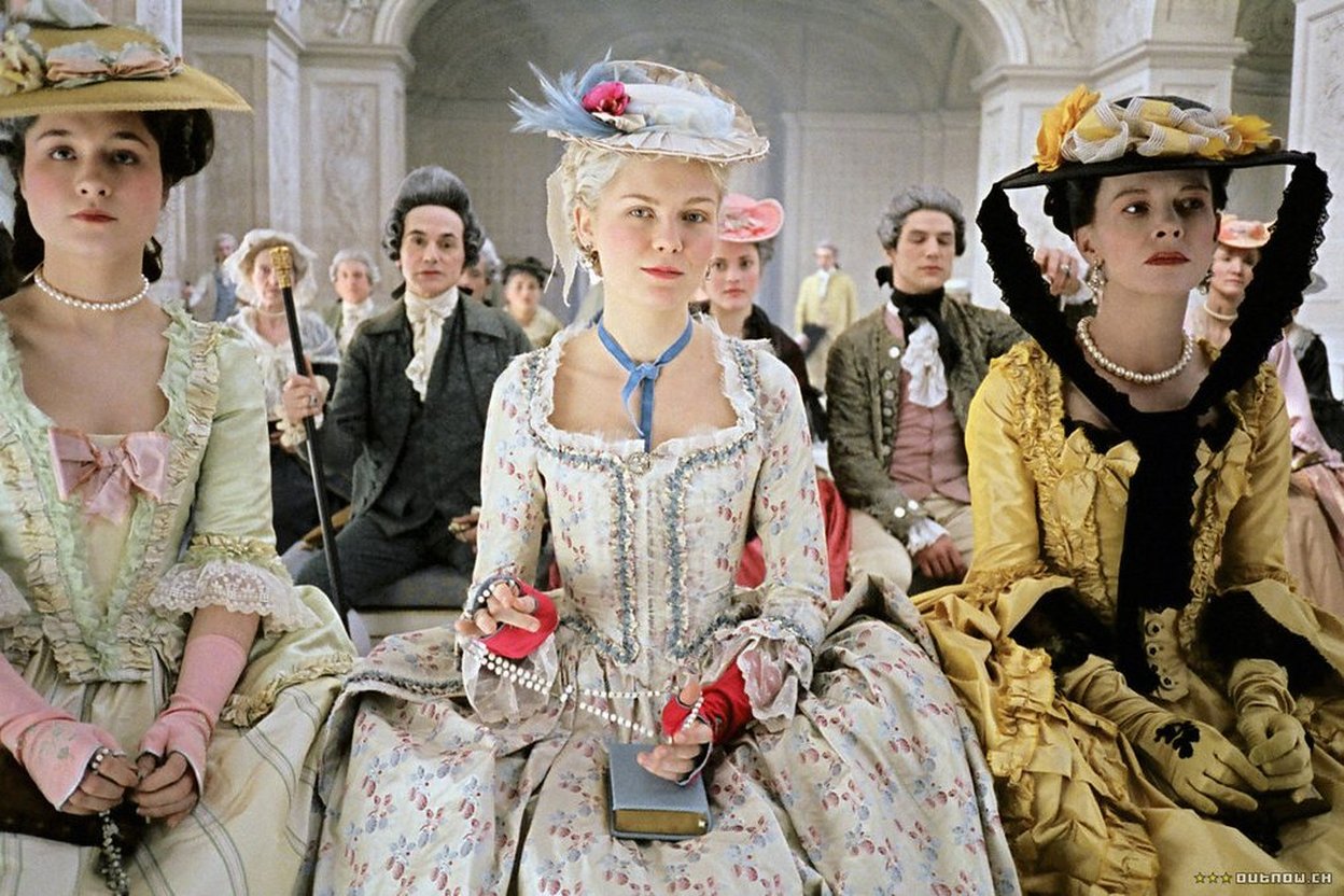 Women in 18th-century court gowns.